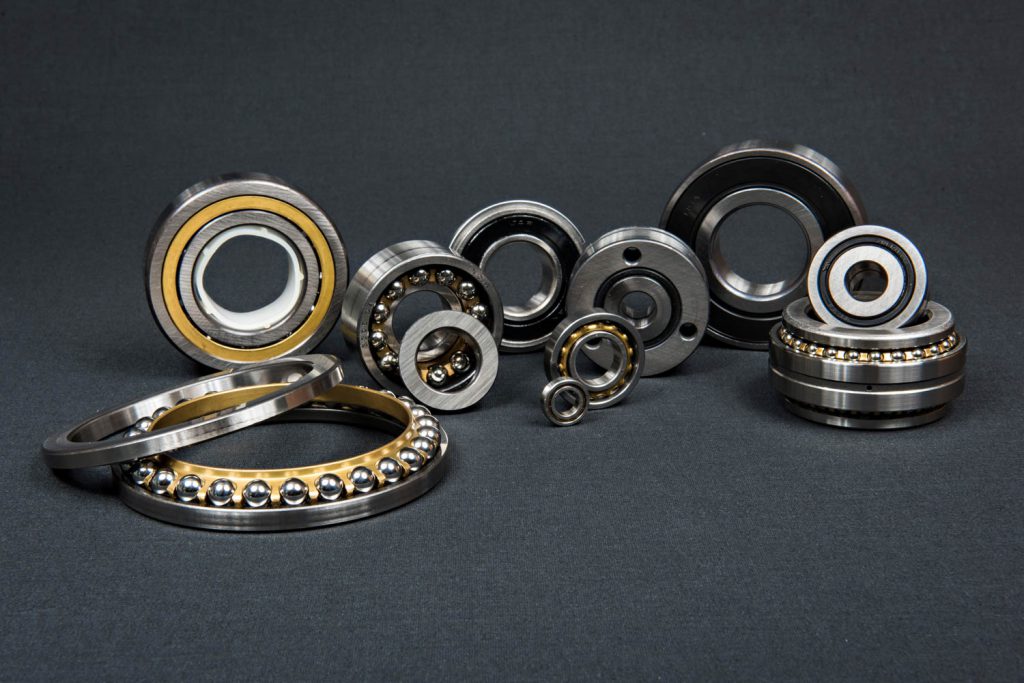 Angular Contact bearings photographed on gray background